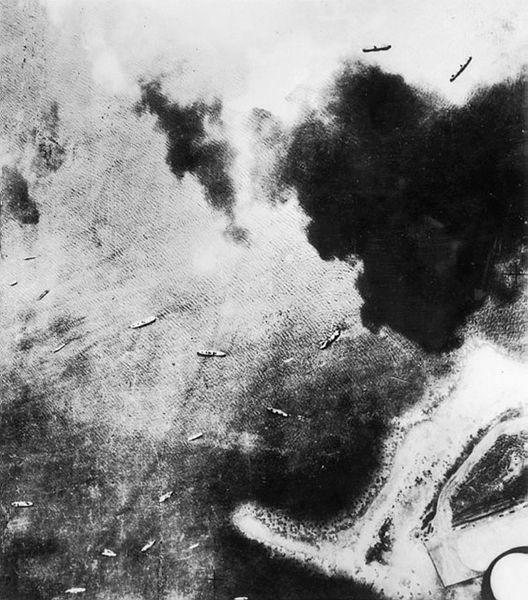 A black and white photograph of ships in the ocean.