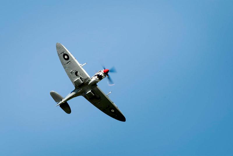 A Spitfire aircraft flying through the air.