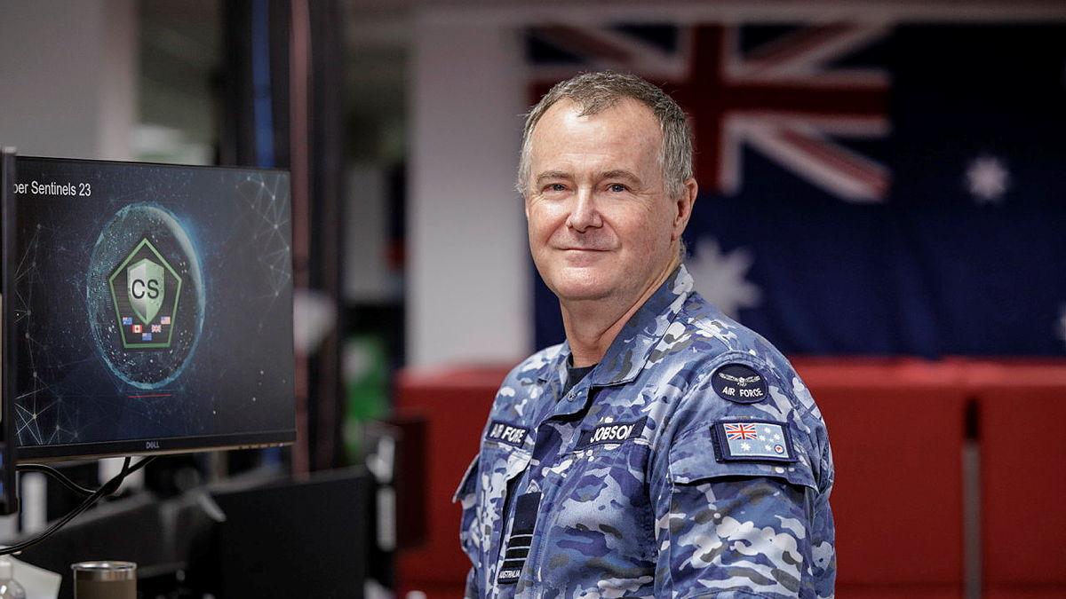A military member works at his desk.