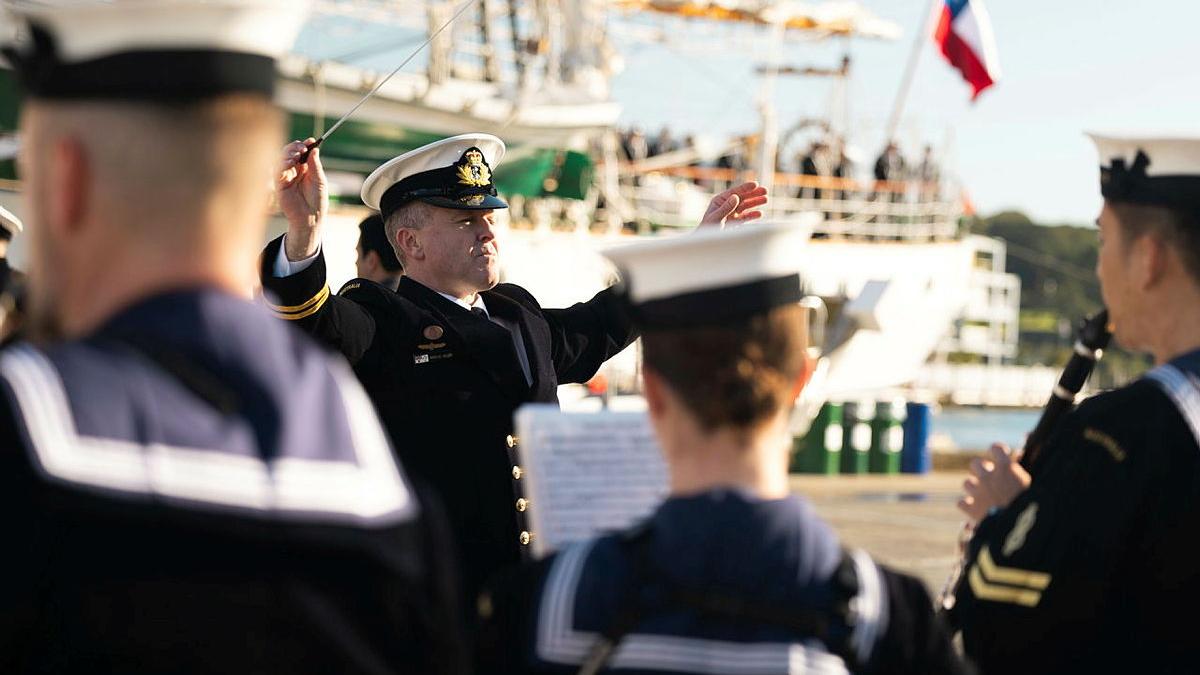 A man conducts a band.