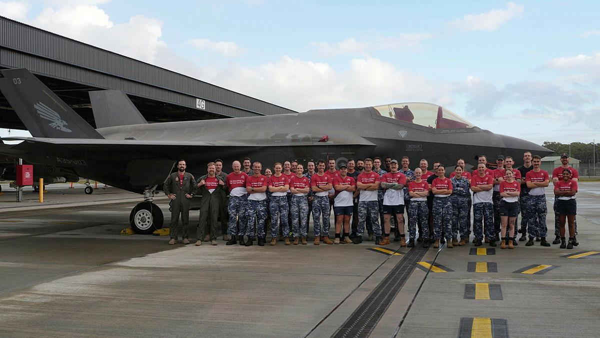 No 3 Squadron personnel who were part of the top fundraising team in this year’s March On, in front of a No 3 Squadron F-35A Lightning II aircraft at RAAF Base Williamtown, NSW.