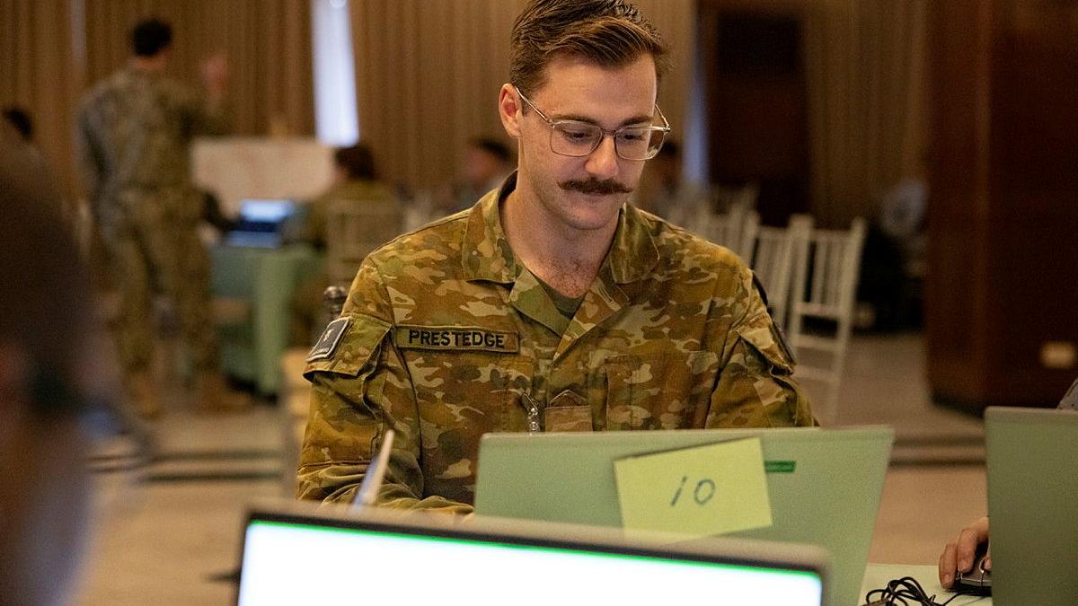 A soldier at a computer.