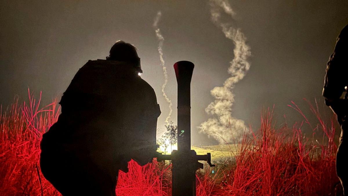 Australian Army soldiers from the First Battalion, Royal Australian Regiment mortar platoon fire illumination rounds as part of the combined mortar activity at Townsville Field Training Area.