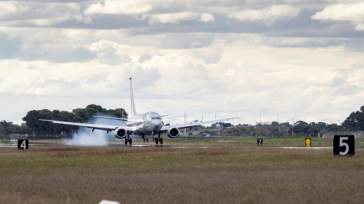 An aircraft taxis on the runway. 