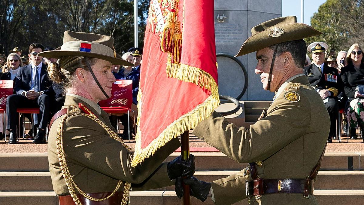 The 41st Chief of the Australian Army Lieutenant General Simon Stuart AO DSC (right) hands The Army Banner to the 42nd Chief of the Australian Army Lieutenant General Susan Coyle AM CSC DSM as the symbol of the change of command of the Australian Army.
