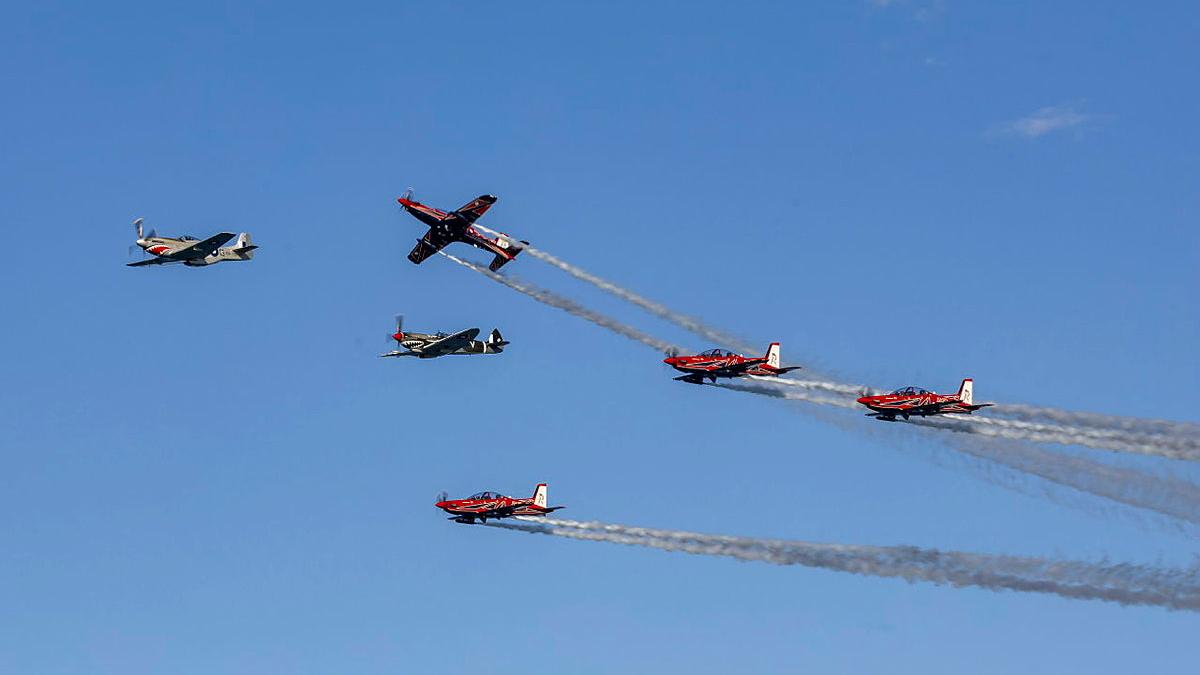 Six aircraft fly in formation.