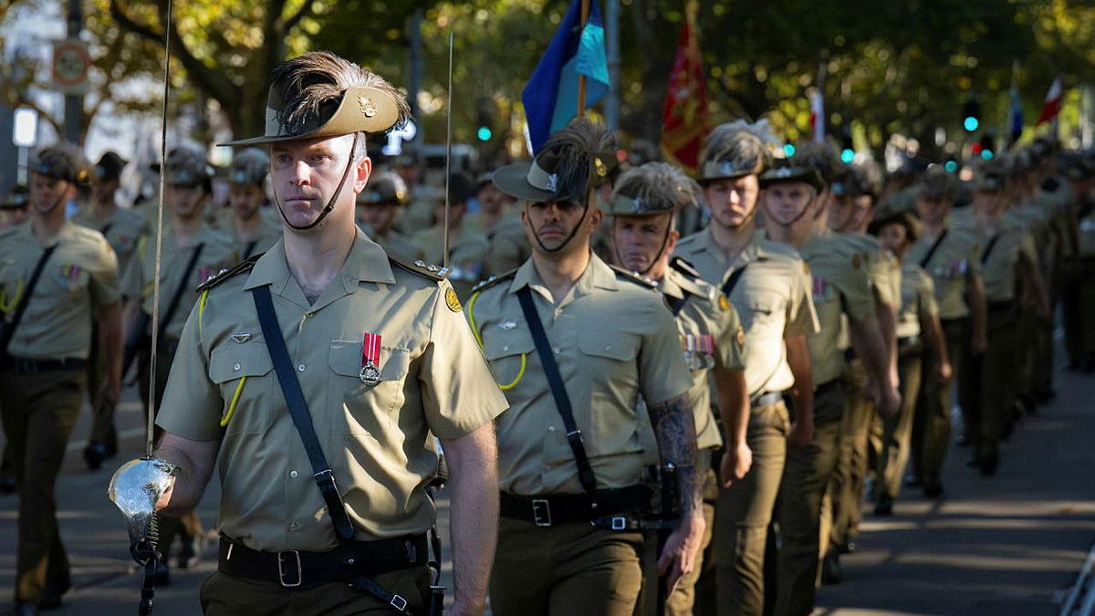 Soldiers march in formation.