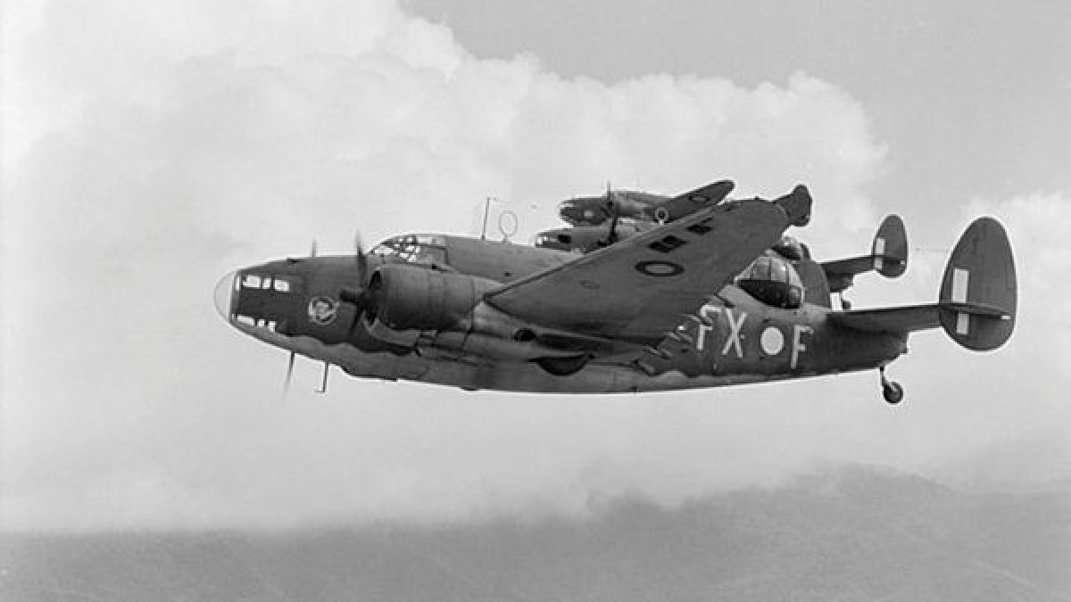 A black and white photo of three aircraft flying in formation.